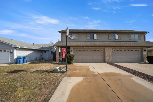 a front view of a house with a garage