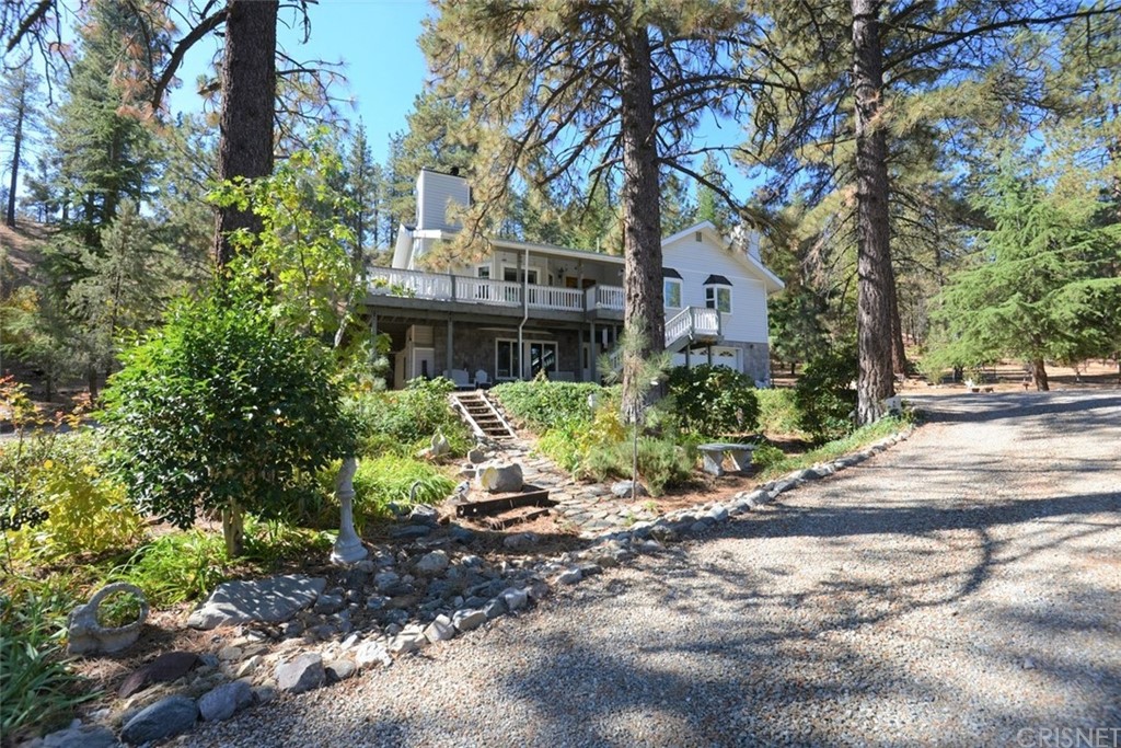 11620 Steinhoff Road Frazier Park, CA 93225 - Photo 1 of 1 a house is sitting in middle of forest