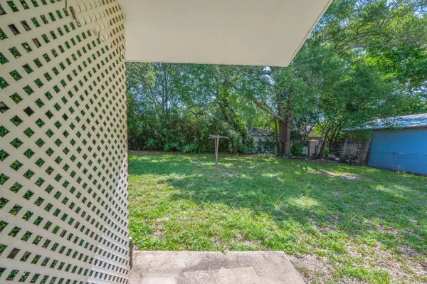 a view of a backyard with a trees