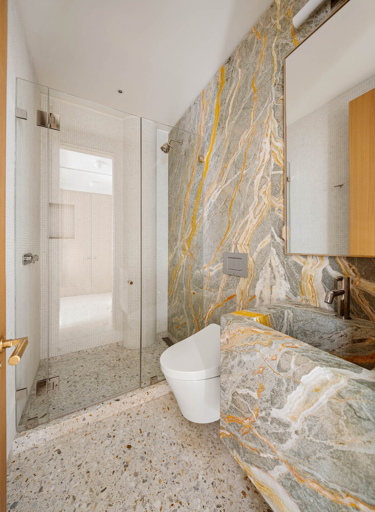 50 Wooster Street, Unit 4NR Manhattan, NY 10013 - Photo 13 of 16 a bathroom with a granite countertop sink a toilet and shower