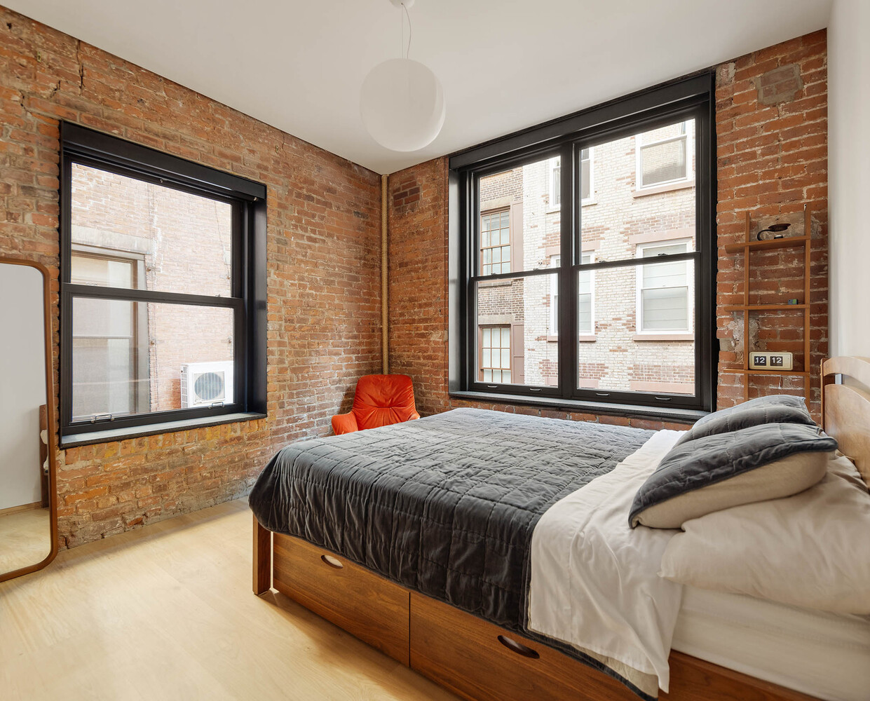 50 Wooster Street, Unit 4NR Manhattan, NY 10013 - Photo 14 of 16 a bedroom with a bed and a large window