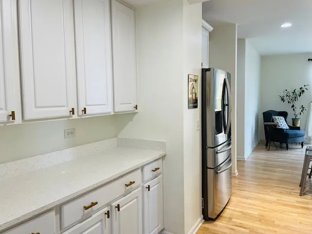 a kitchen with appliances and cabinets