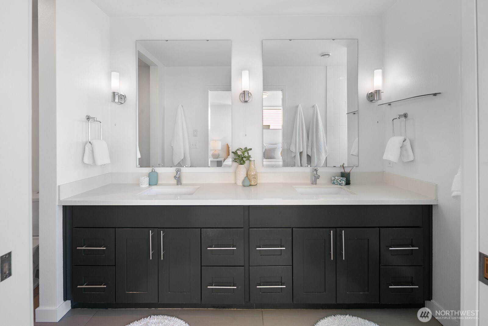 2808 14th Avenue West, Unit B Seattle, WA 98119 - Photo 16 of 39 a bathroom with a double vanity sink and a mirror