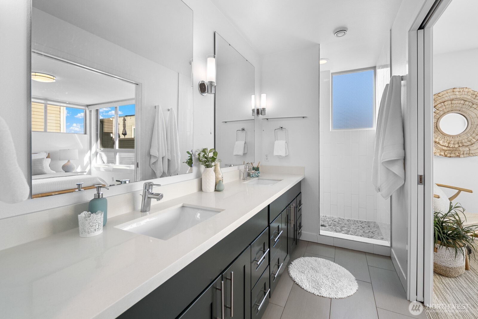 2808 14th Avenue West, Unit B Seattle, WA 98119 - Photo 17 of 39 a bathroom with a double vanity sink toilet and shower