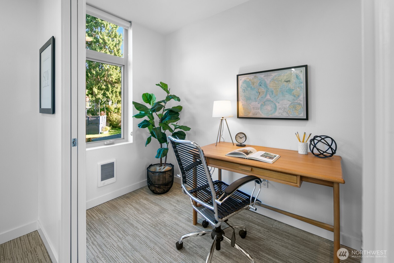 2808 14th Avenue West, Unit B Seattle, WA 98119 - Photo 20 of 39 a view of a workspace with furniture and a potted plant