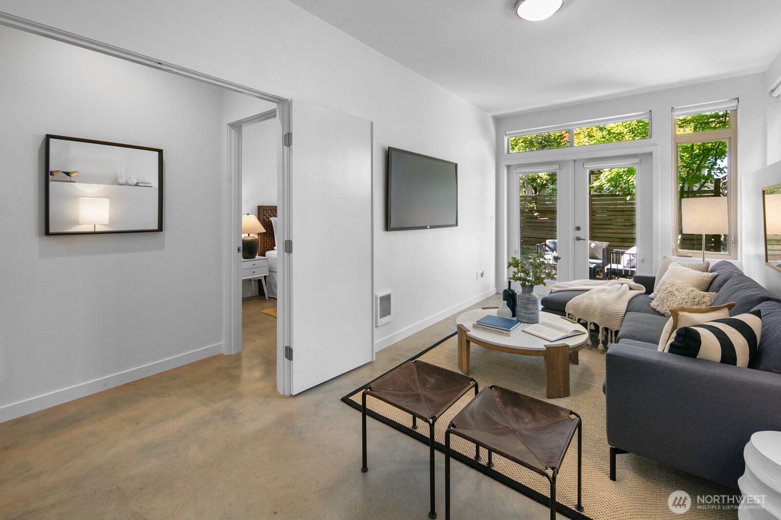 2808 14th Avenue West, Unit B Seattle, WA 98119 - Photo 23 of 39 a living room with furniture and a flat screen tv