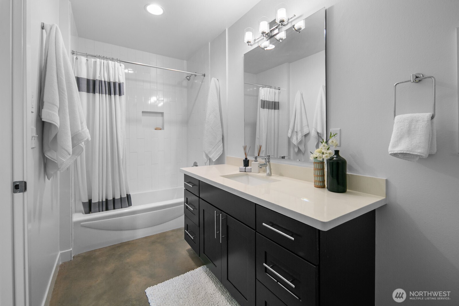 2808 14th Avenue West, Unit B Seattle, WA 98119 - Photo 28 of 39 a bathroom with a sink double vanity and a mirror