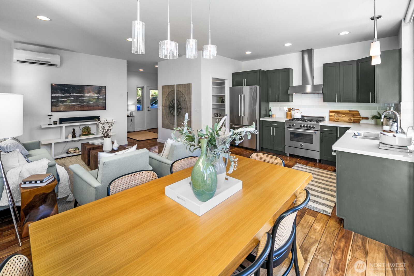 2808 14th Avenue West, Unit B Seattle, WA 98119 - Photo 4 of 39 a view of a dining room with furniture and a kitchen