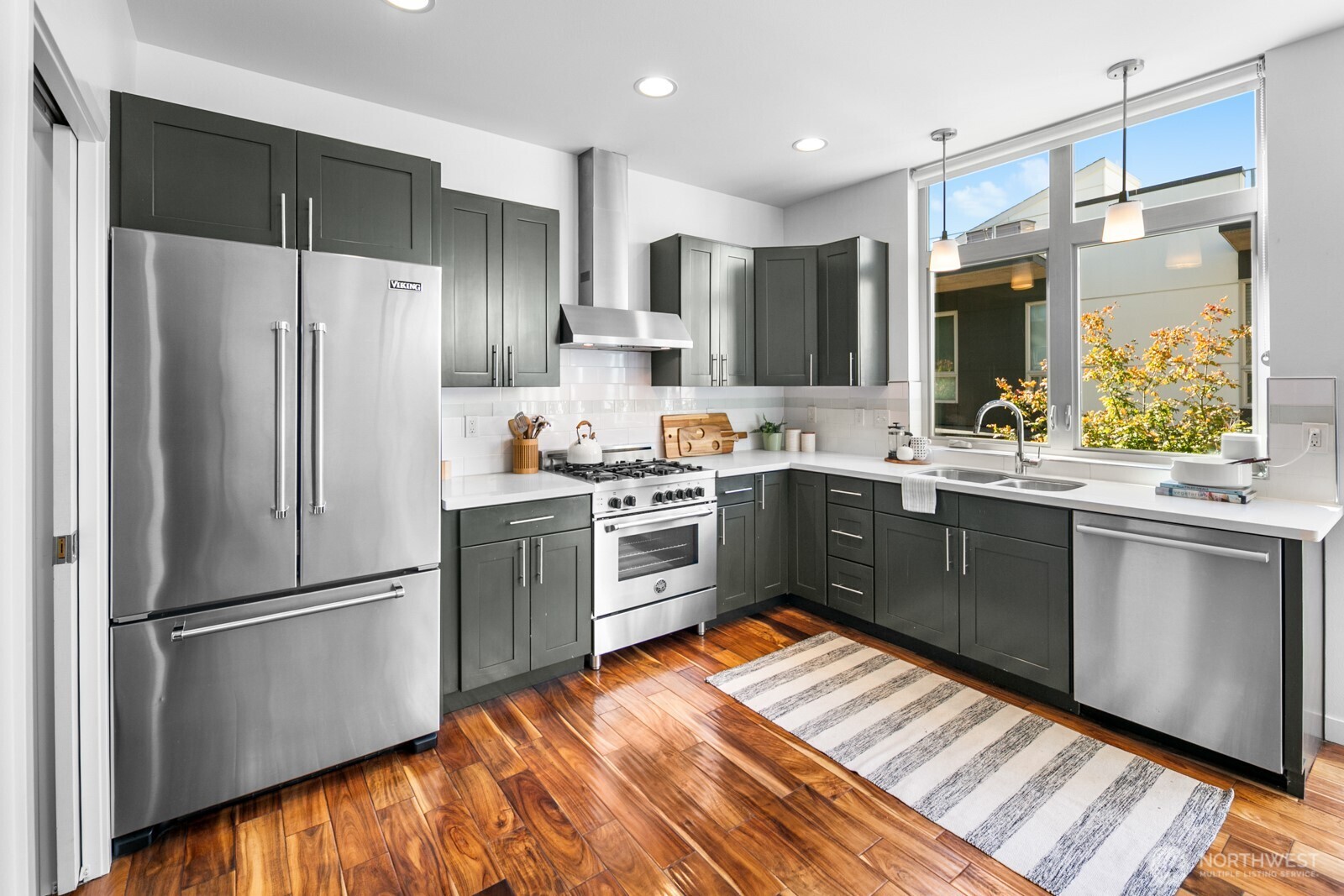 2808 14th Avenue West, Unit B Seattle, WA 98119 - Photo 6 of 39 a kitchen with a refrigerator sink and microwave