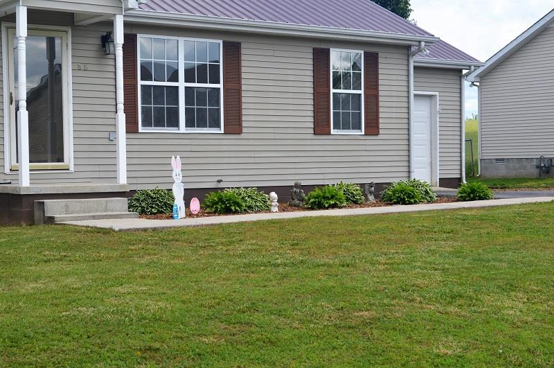 188 Modena Circle Decherd, TN 37324 - Photo 2 of 23 Beautiful landscaping for your guest to enjoy as they come to the front door.
