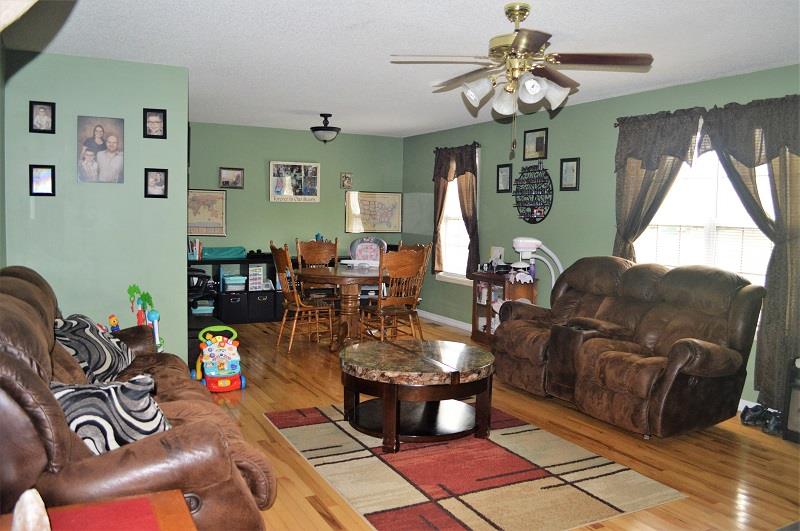188 Modena Circle Decherd, TN 37324 - Photo 4 of 23 Lots of natural light with the oversize double window. Don't miss the gorgeous hardwood floor.