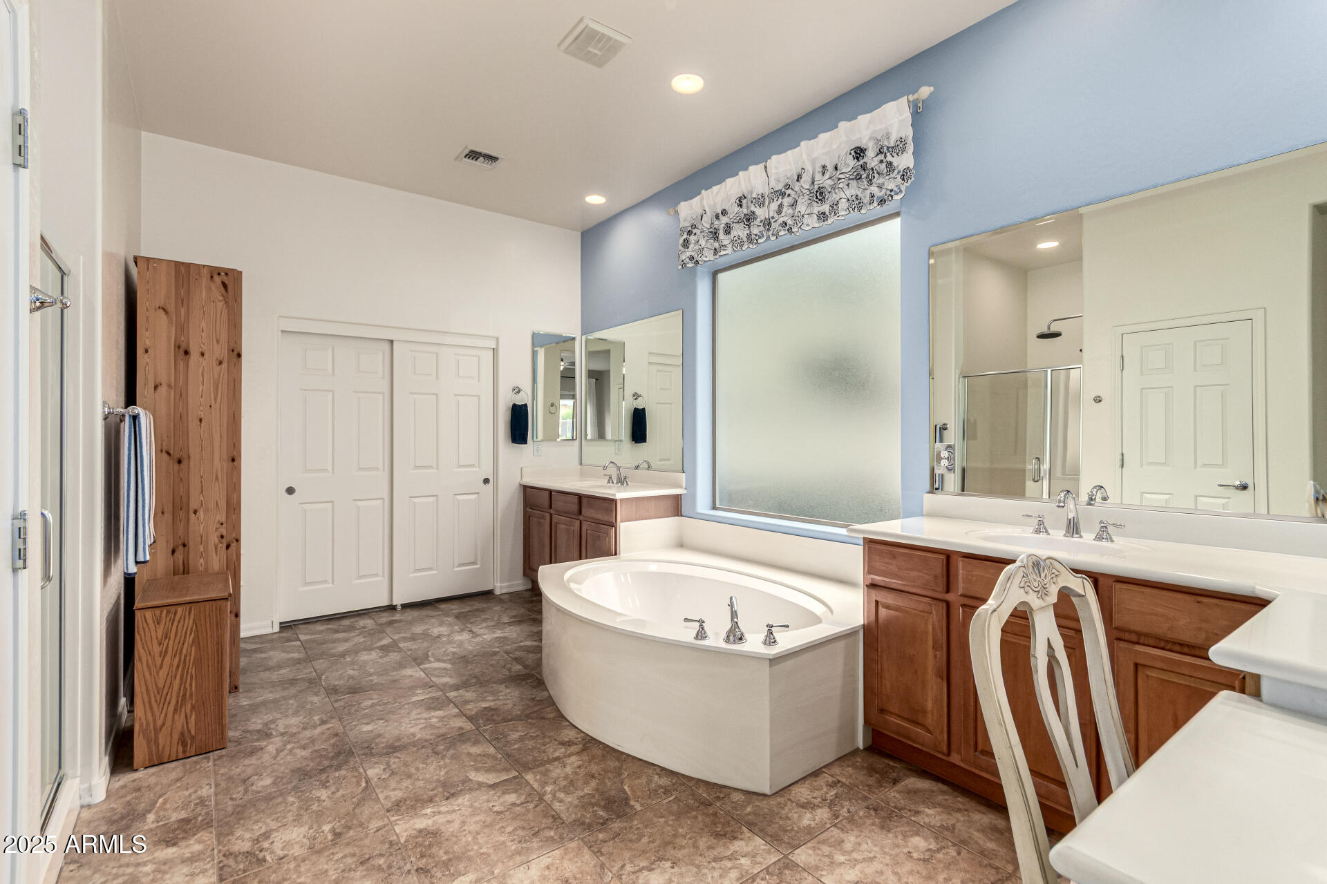 4808 West Cavalry Road Phoenix, AZ 85087 - Photo 25 of 67 a large spacious bathroom with a tub and shower