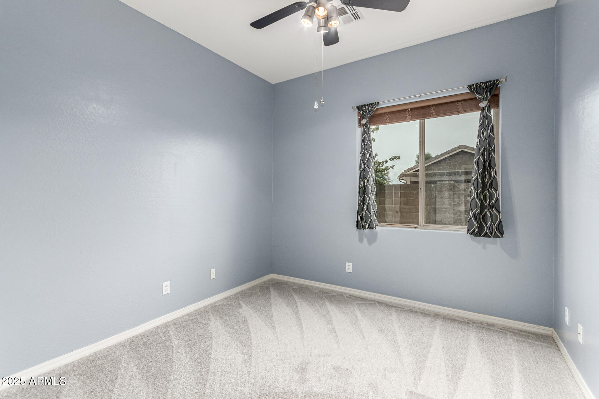 4808 West Cavalry Road Phoenix, AZ 85087 - Photo 31 of 67 a view of an empty room with a window