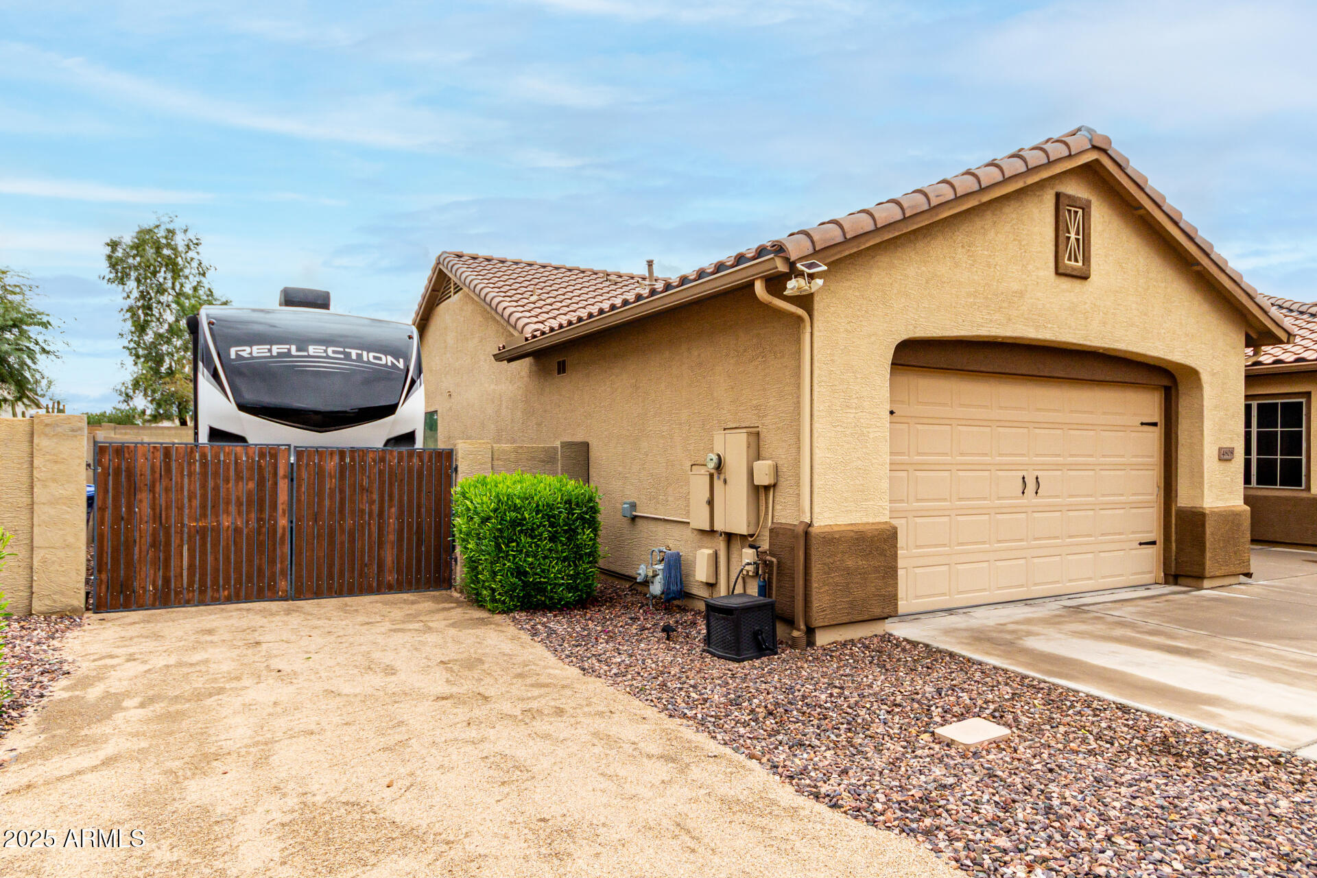 4808 West Cavalry Road Phoenix, AZ 85087 - Photo 3 of 67 a front view of a house with a yard and garage