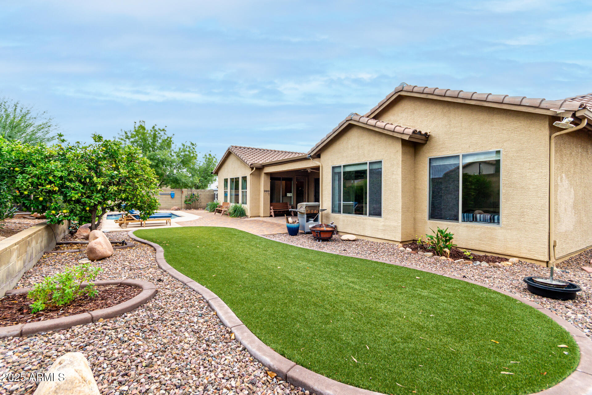 4808 West Cavalry Road Phoenix, AZ 85087 - Photo 41 of 67 a view of a house with backyard sitting area and garden