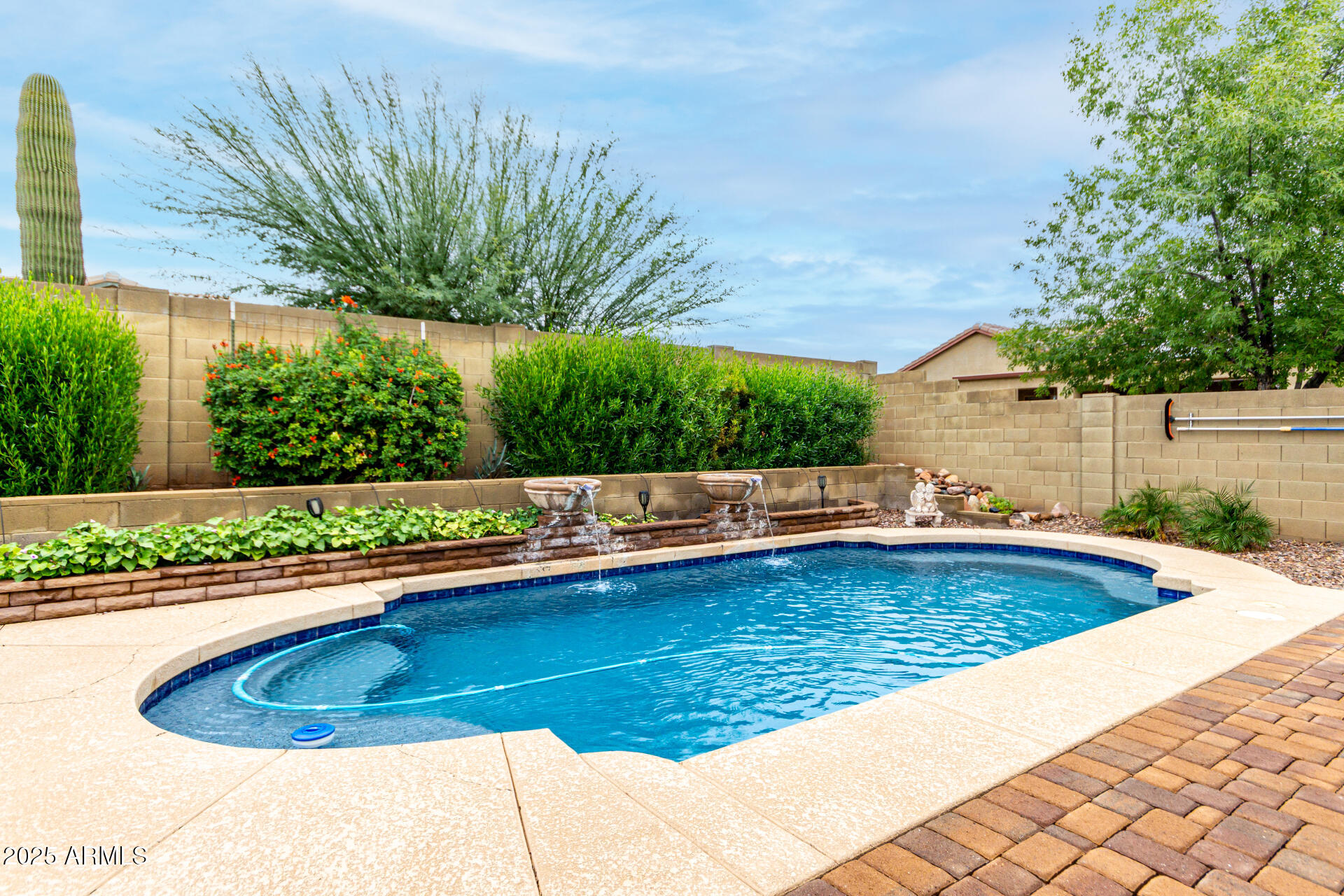4808 West Cavalry Road Phoenix, AZ 85087 - Photo 42 of 67 a view of a swimming pool with a patio