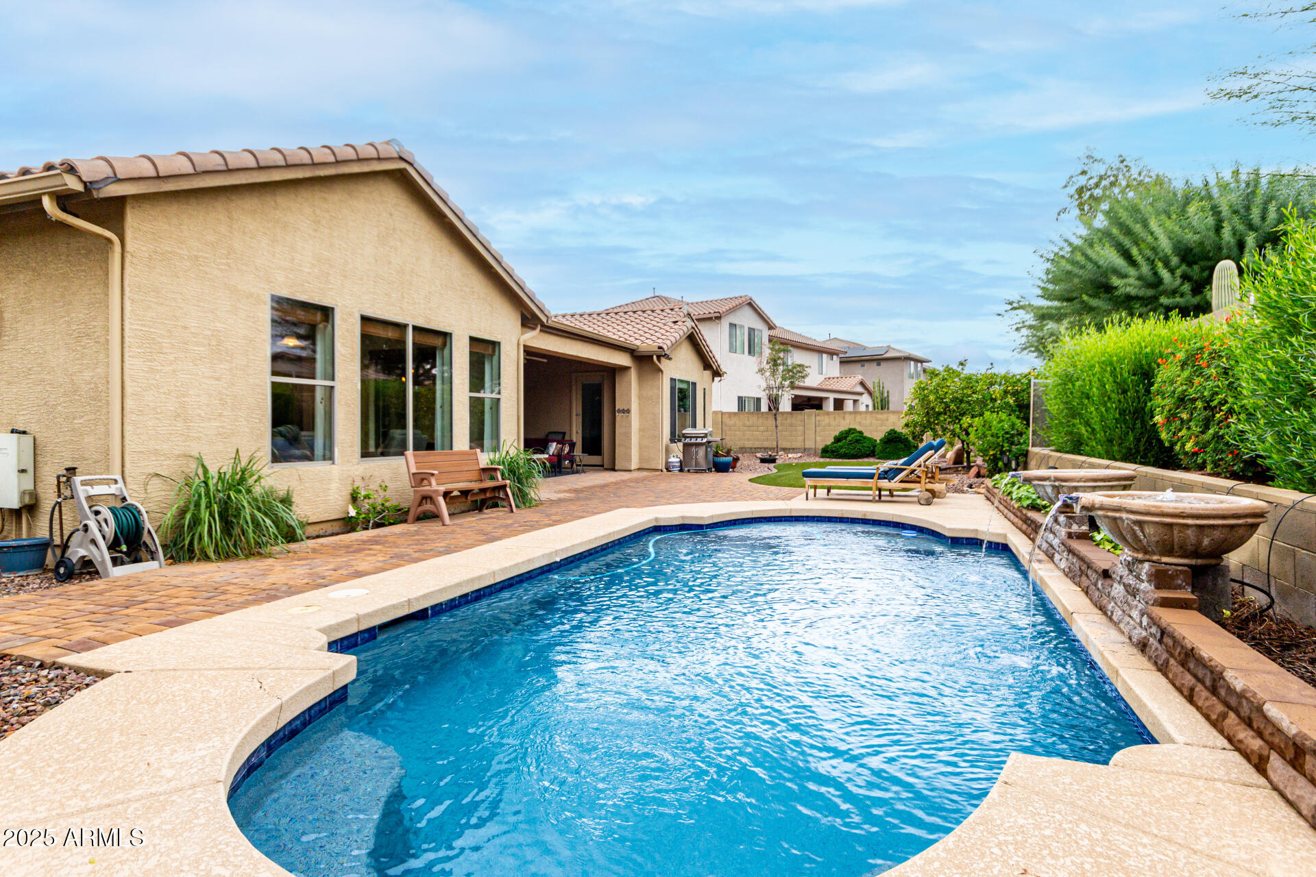 4808 West Cavalry Road Phoenix, AZ 85087 - Photo 43 of 67 a swimming pool with outdoor seating and yard