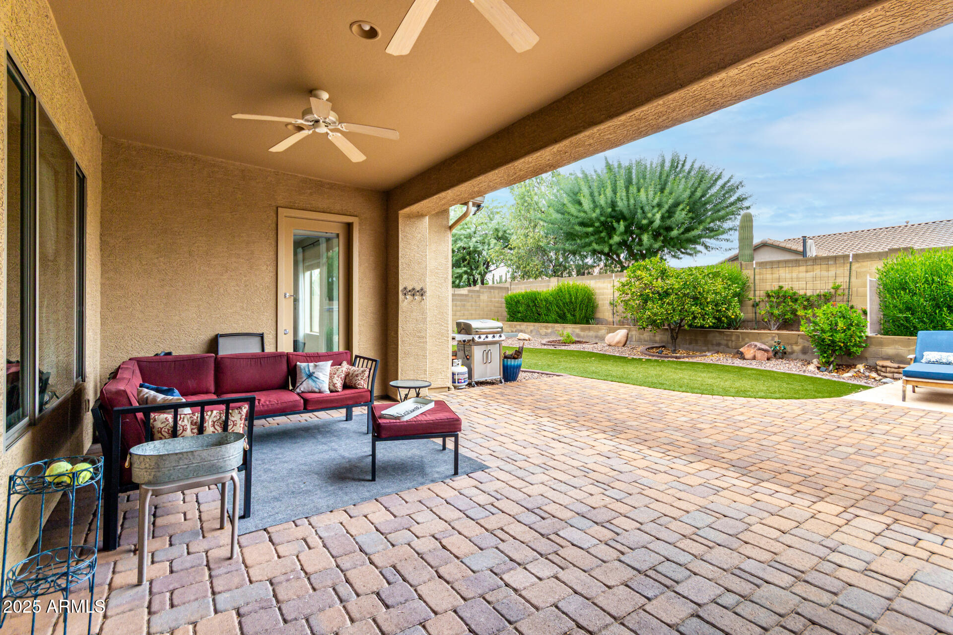 4808 West Cavalry Road Phoenix, AZ 85087 - Photo 45 of 67 a view of a patio with dining table and chairs with a yard