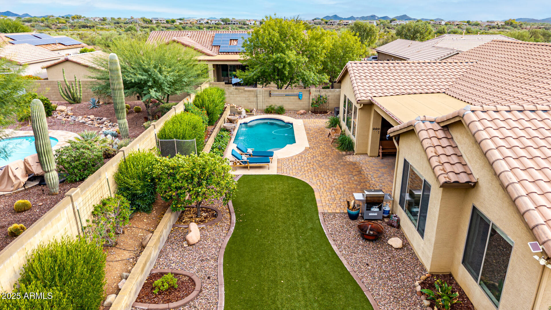 4808 West Cavalry Road Phoenix, AZ 85087 - Photo 47 of 67 an aerial view of a house with a garden space