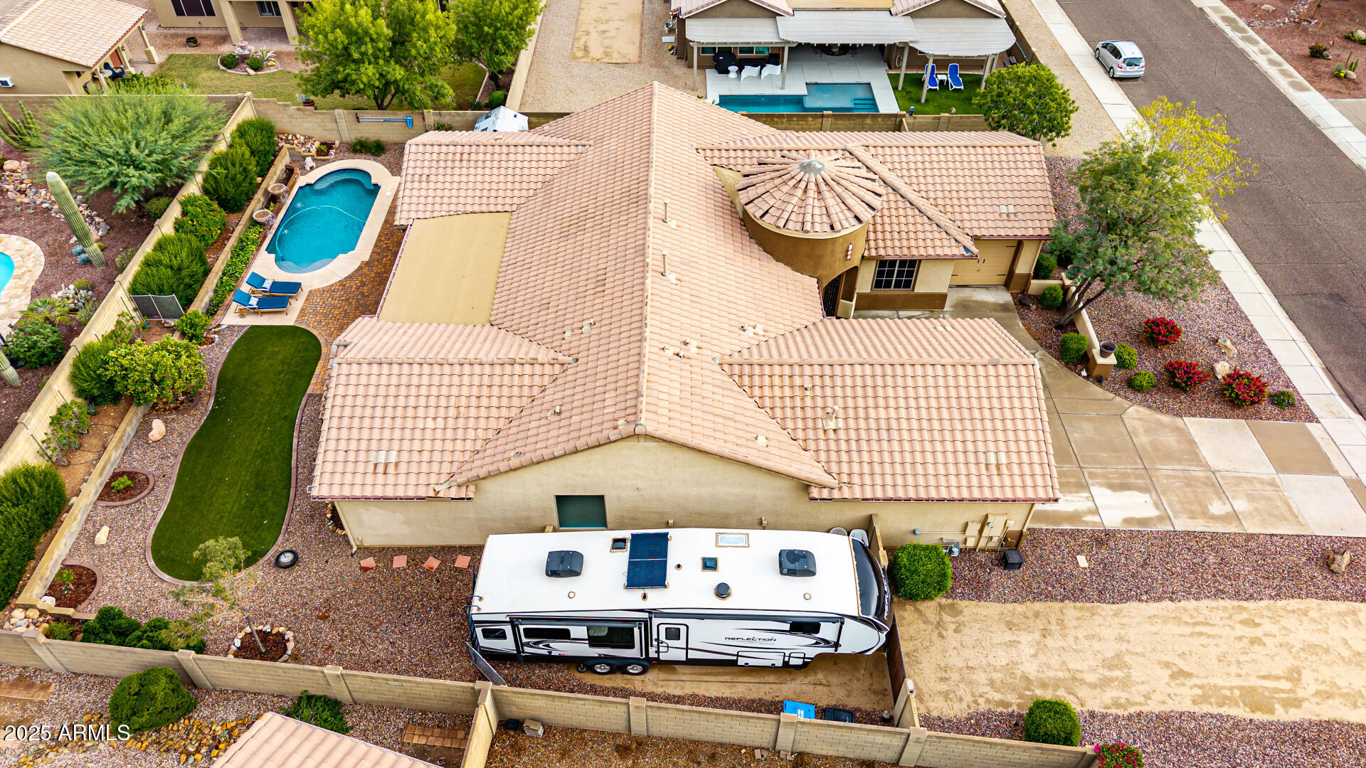 4808 West Cavalry Road Phoenix, AZ 85087 - Photo 48 of 67 an aerial view of a house with a yard and furniture