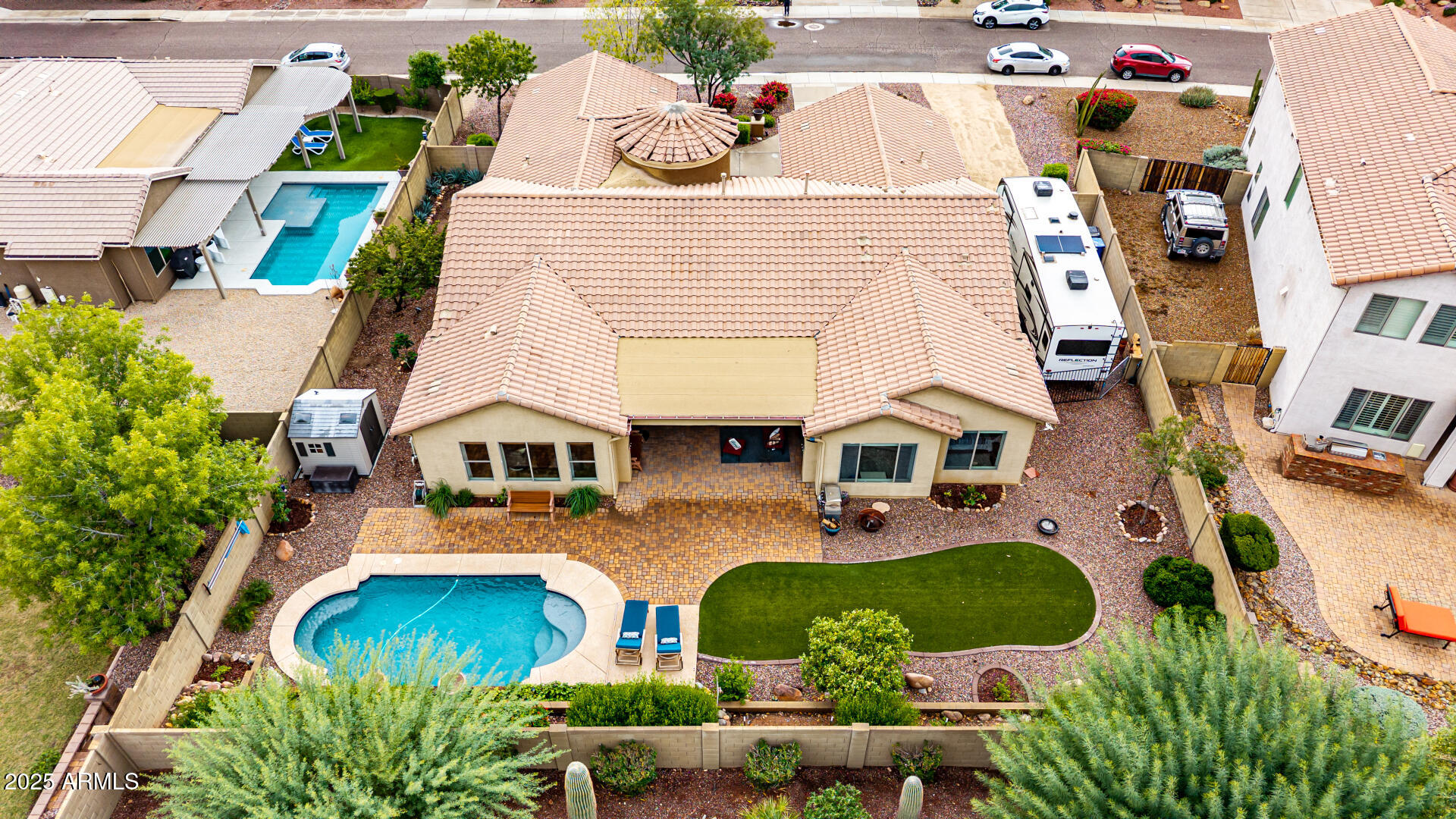4808 West Cavalry Road Phoenix, AZ 85087 - Photo 49 of 67 an aerial view of residential houses with outdoor space and parking