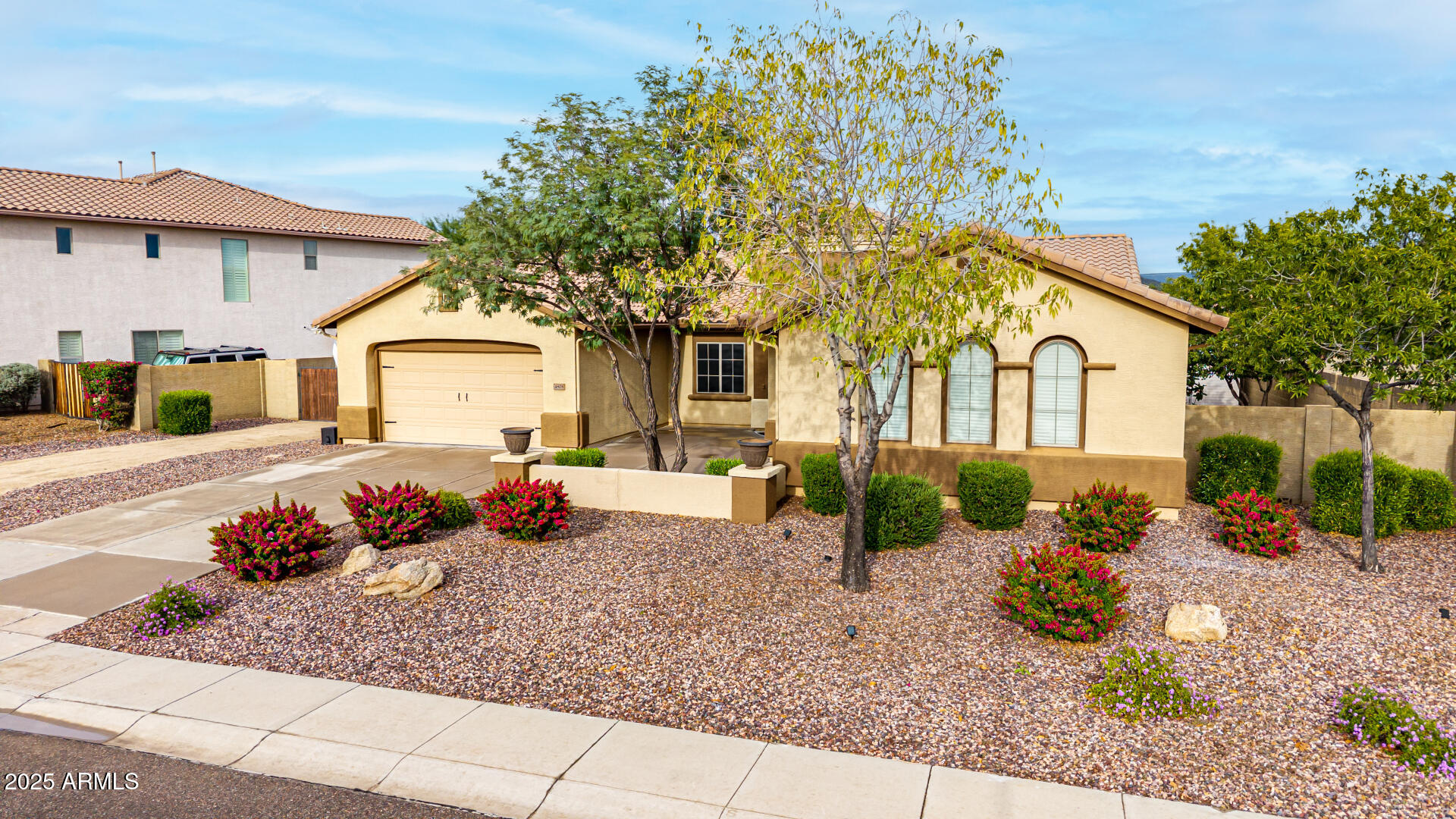 4808 West Cavalry Road Phoenix, AZ 85087 - Photo 53 of 67 a front view of a house with garden