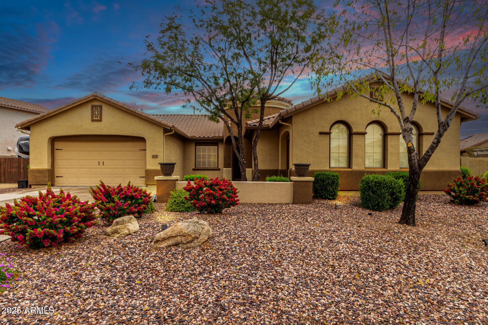 4808 West Cavalry Road Phoenix, AZ 85087 - Photo 5 of 67 a front view of a house with a yard