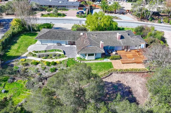 an aerial view of a house with garden