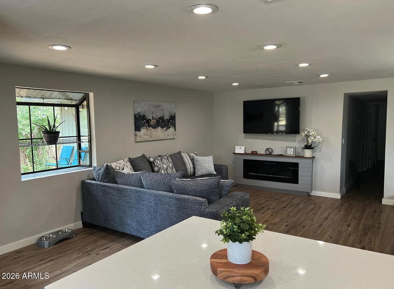 209 West Estate Lane Payson, AZ 85541 - Photo 2 of 11 a living room with furniture and a flat screen tv