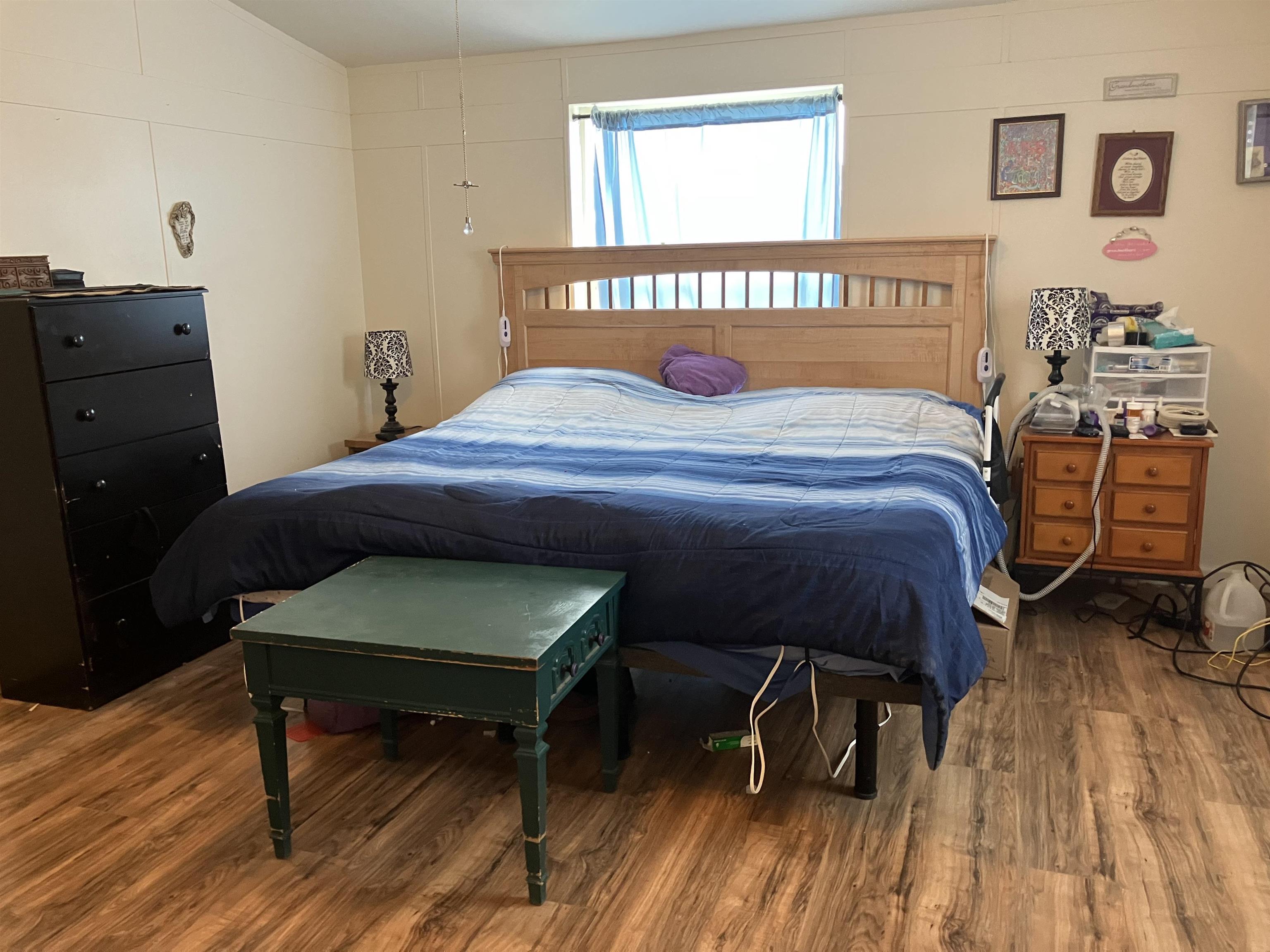 424 32 Road, Unit 388 Clifton, CO 81520 - Photo 13 of 16 a bedroom with a bed and a table