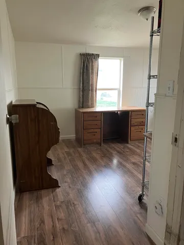 a view of entryway with wooden floor