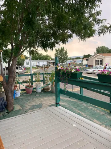 a view of a street with cars parked