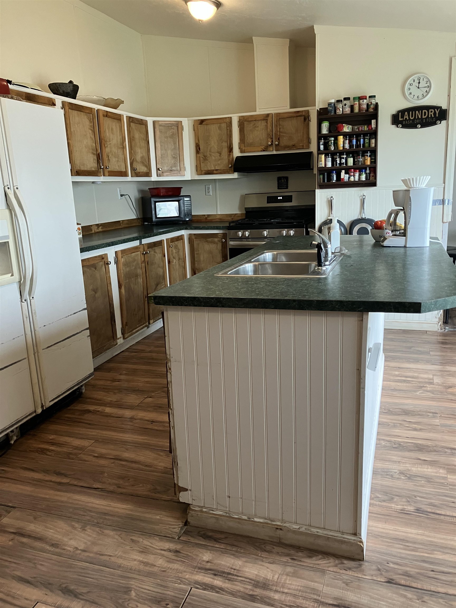 424 32 Road, Unit 388 Clifton, CO 81520 - Photo 5 of 16 a kitchen with stainless steel appliances granite countertop a sink and a microwave