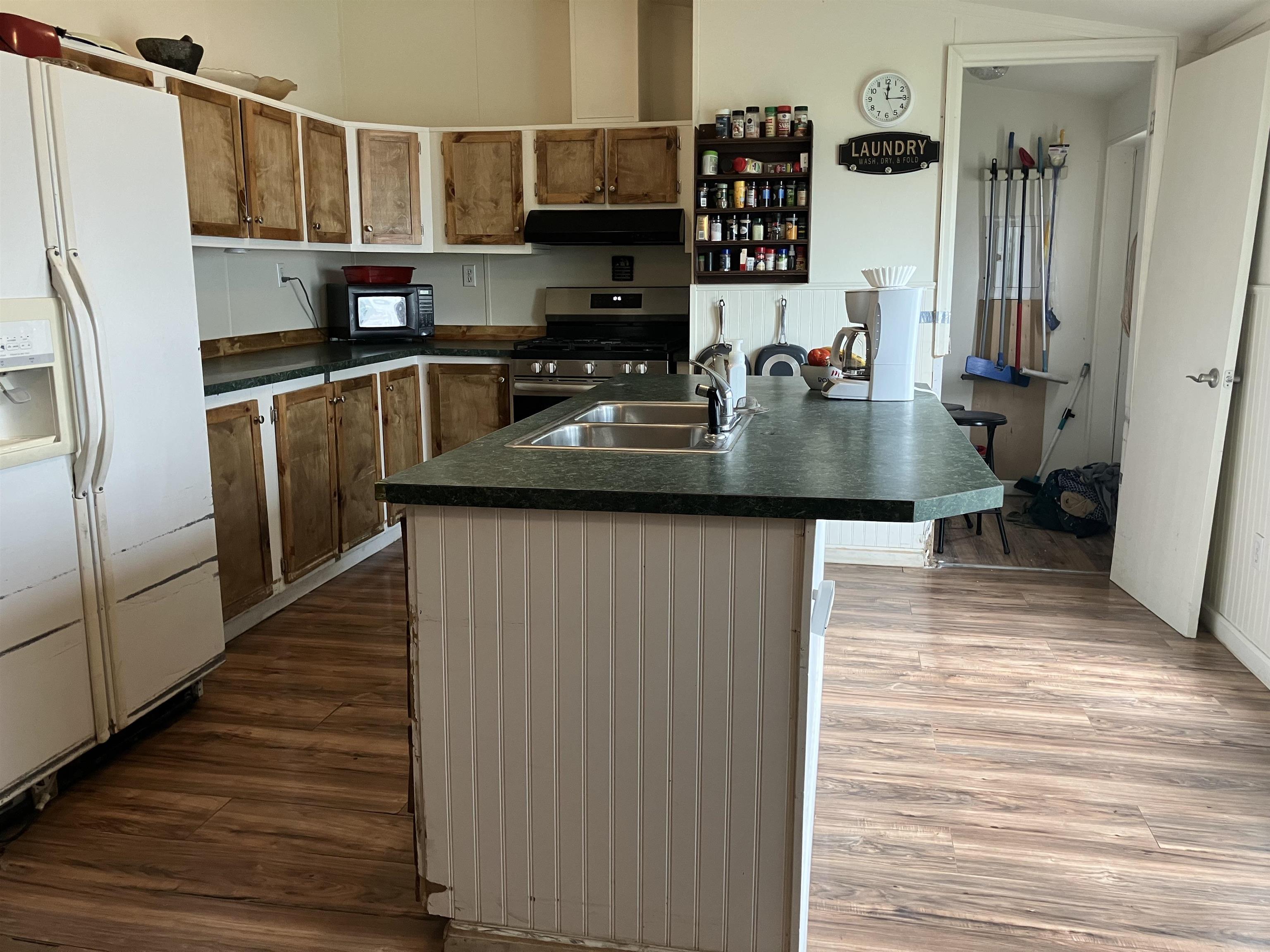424 32 Road, Unit 388 Clifton, CO 81520 - Photo 6 of 16 a kitchen with stainless steel appliances granite countertop a sink refrigerator and cabinets
