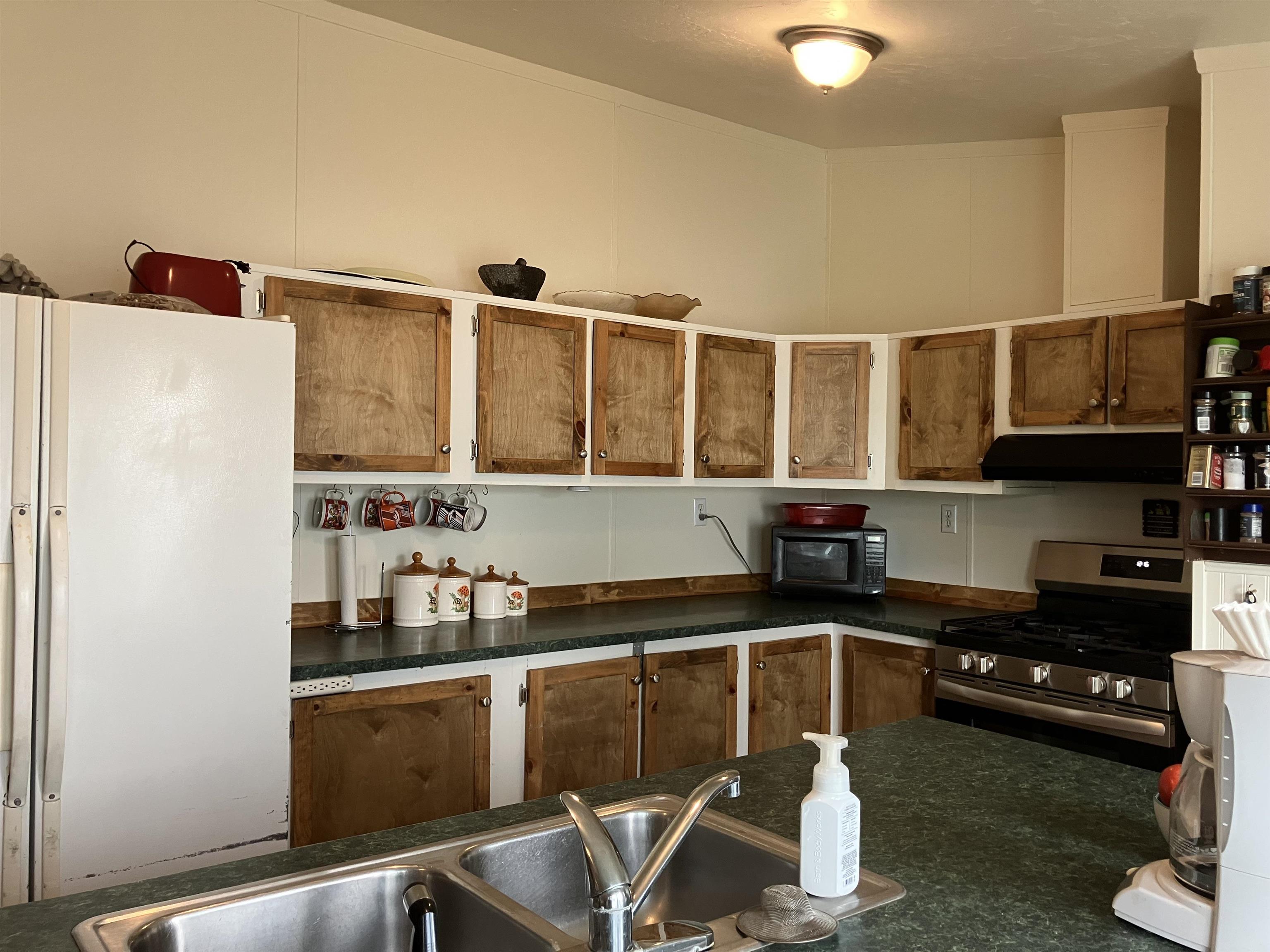 424 32 Road, Unit 388 Clifton, CO 81520 - Photo 7 of 16 a kitchen with stainless steel appliances a stove and refrigerator