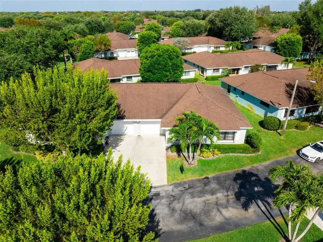 an aerial view of a house with a garden