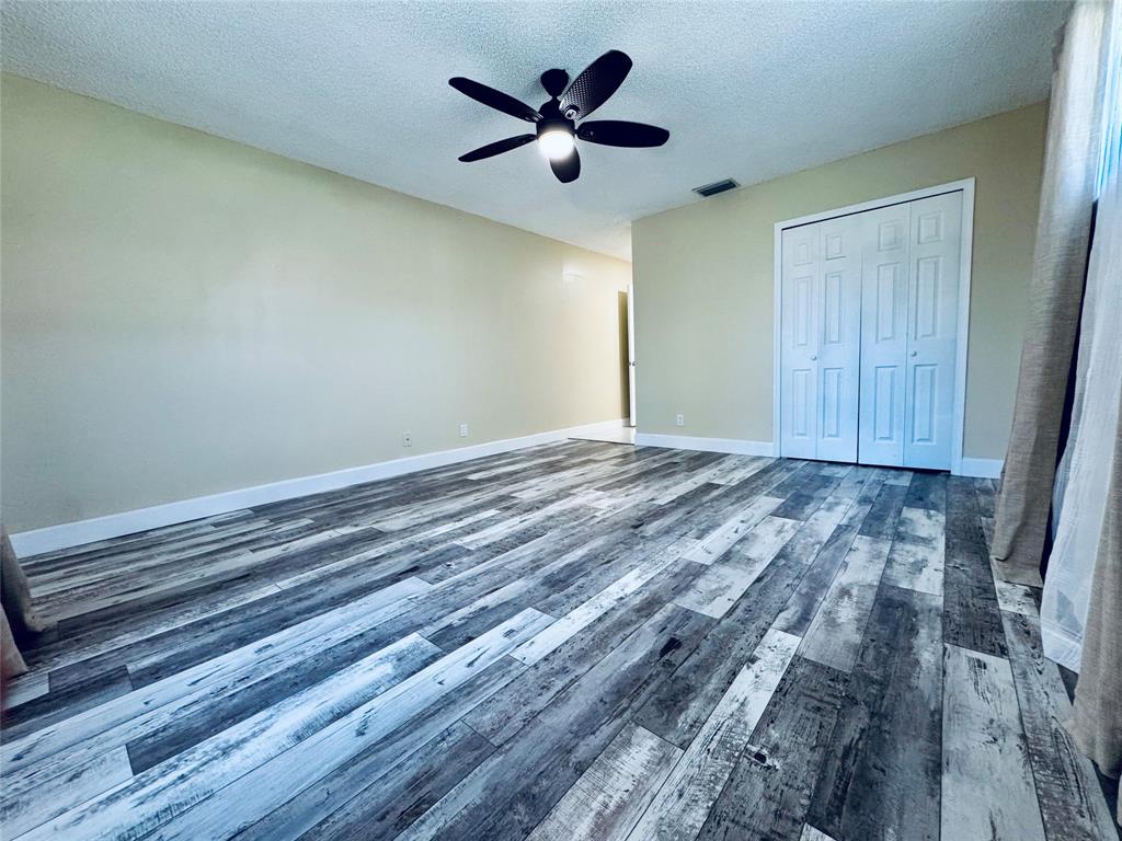 9870 Pecan Tree Drive, Unit B Boynton Beach, FL 33436 - Photo 14 of 33 a view of an empty room with a window
