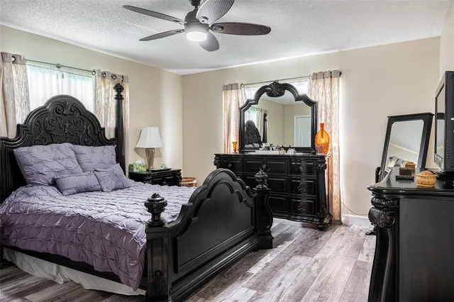 an empty room with wooden floor and a window
