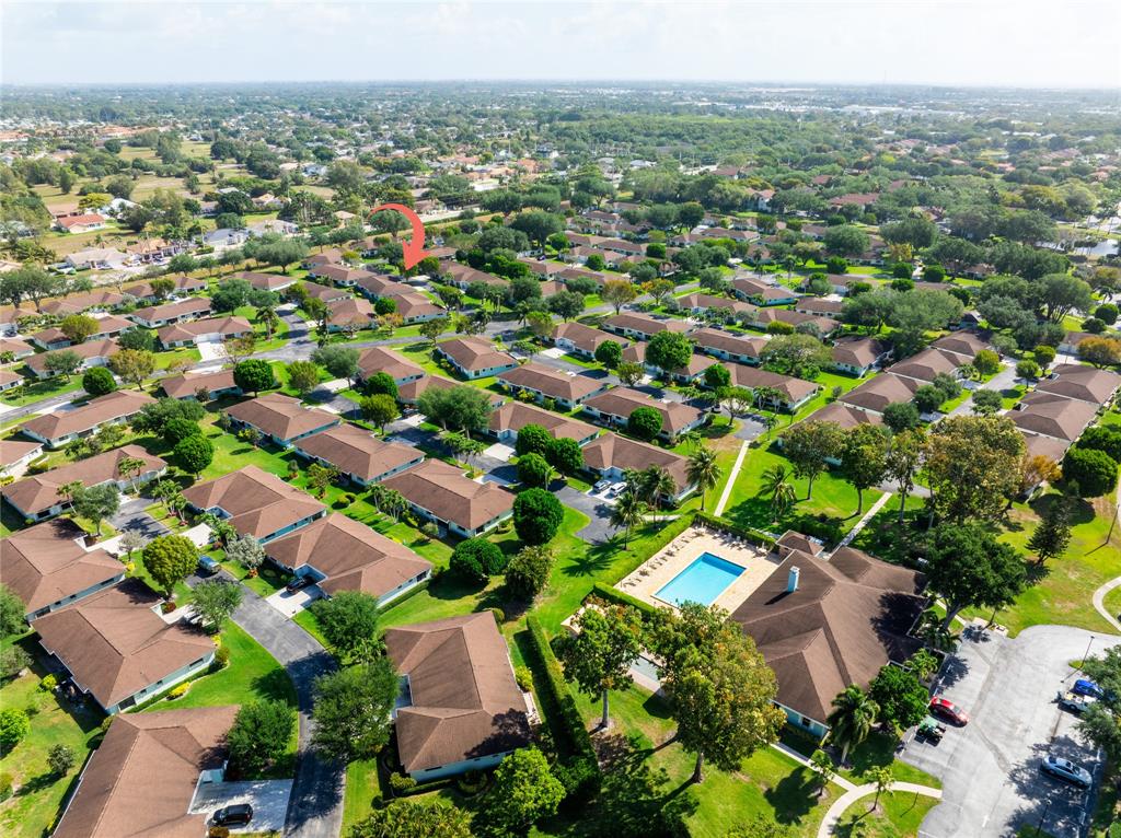 9870 Pecan Tree Drive, Unit B Boynton Beach, FL 33436 - Photo 2 of 33 an aerial view of residential houses with outdoor space and trees