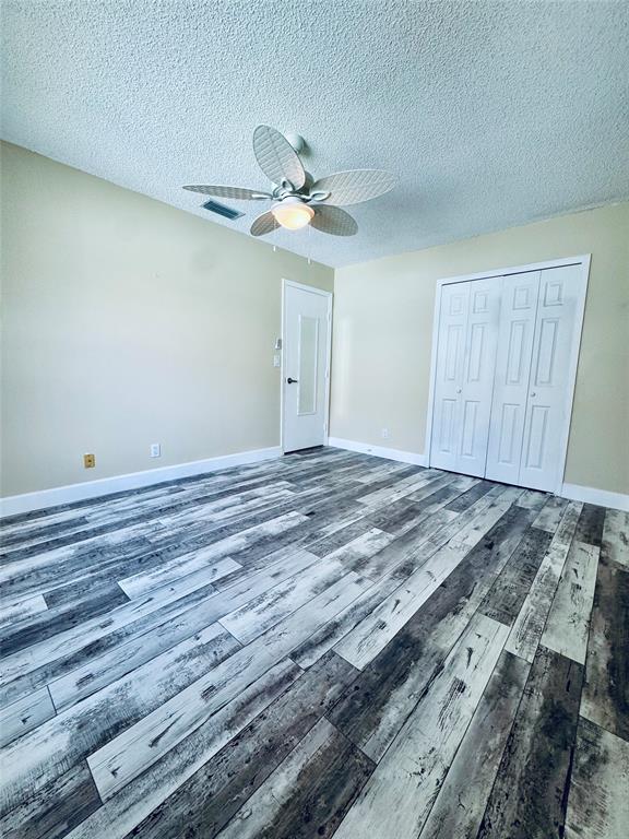 9870 Pecan Tree Drive, Unit B Boynton Beach, FL 33436 - Photo 22 of 33 a view of a room with wooden floor