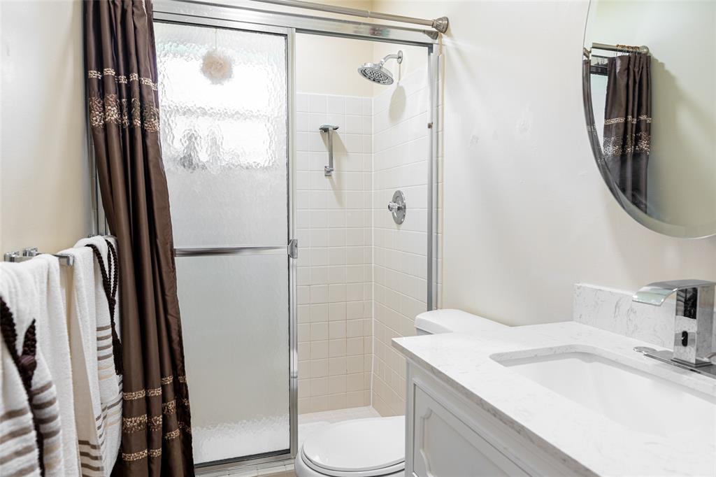 9870 Pecan Tree Drive, Unit B Boynton Beach, FL 33436 - Photo 24 of 33 a bathroom with a sink toilet and shower