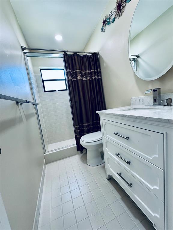 9870 Pecan Tree Drive, Unit B Boynton Beach, FL 33436 - Photo 25 of 33 a bathroom with a granite countertop sink toilet and shower