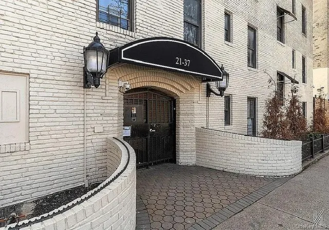a utility room with dryer washer and closet