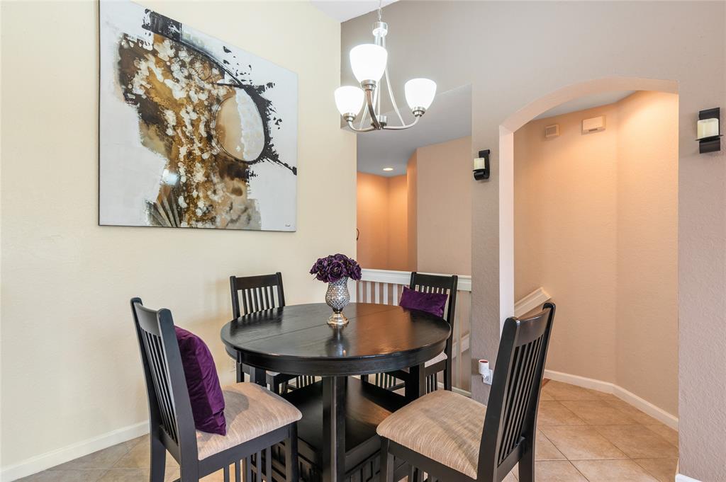 3067 Laurel Ridge Circle Riviera Beach, FL 33404 - Photo 12 of 27 a view of a dining room with furniture and wooden floor