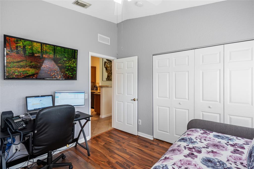 3067 Laurel Ridge Circle Riviera Beach, FL 33404 - Photo 25 of 27 a view of a workspace with furniture and wooden floor