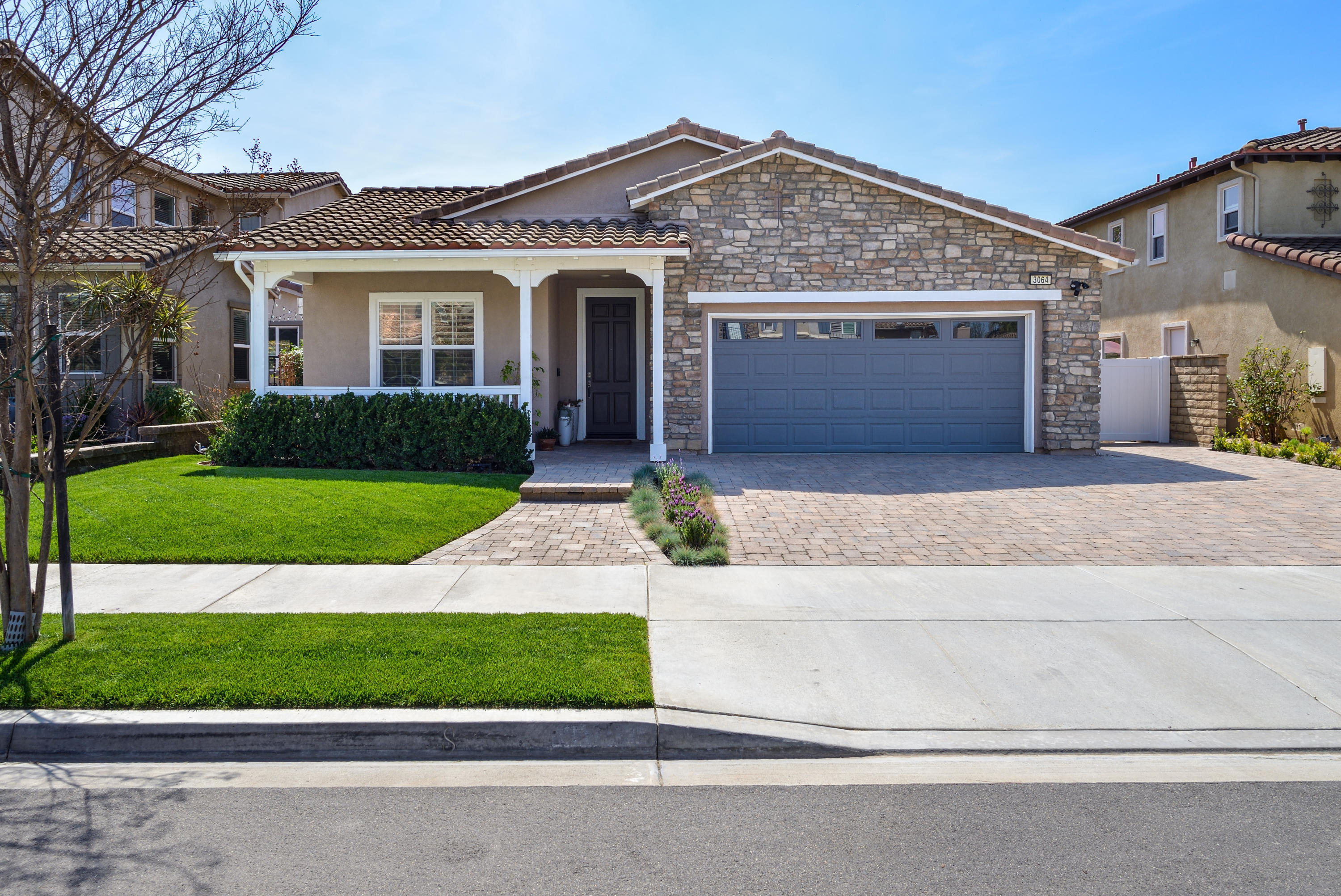 3064 White Rock Road Camarillo, CA 93012 - Photo 2 of 47 a front view of a house with a yard and garage