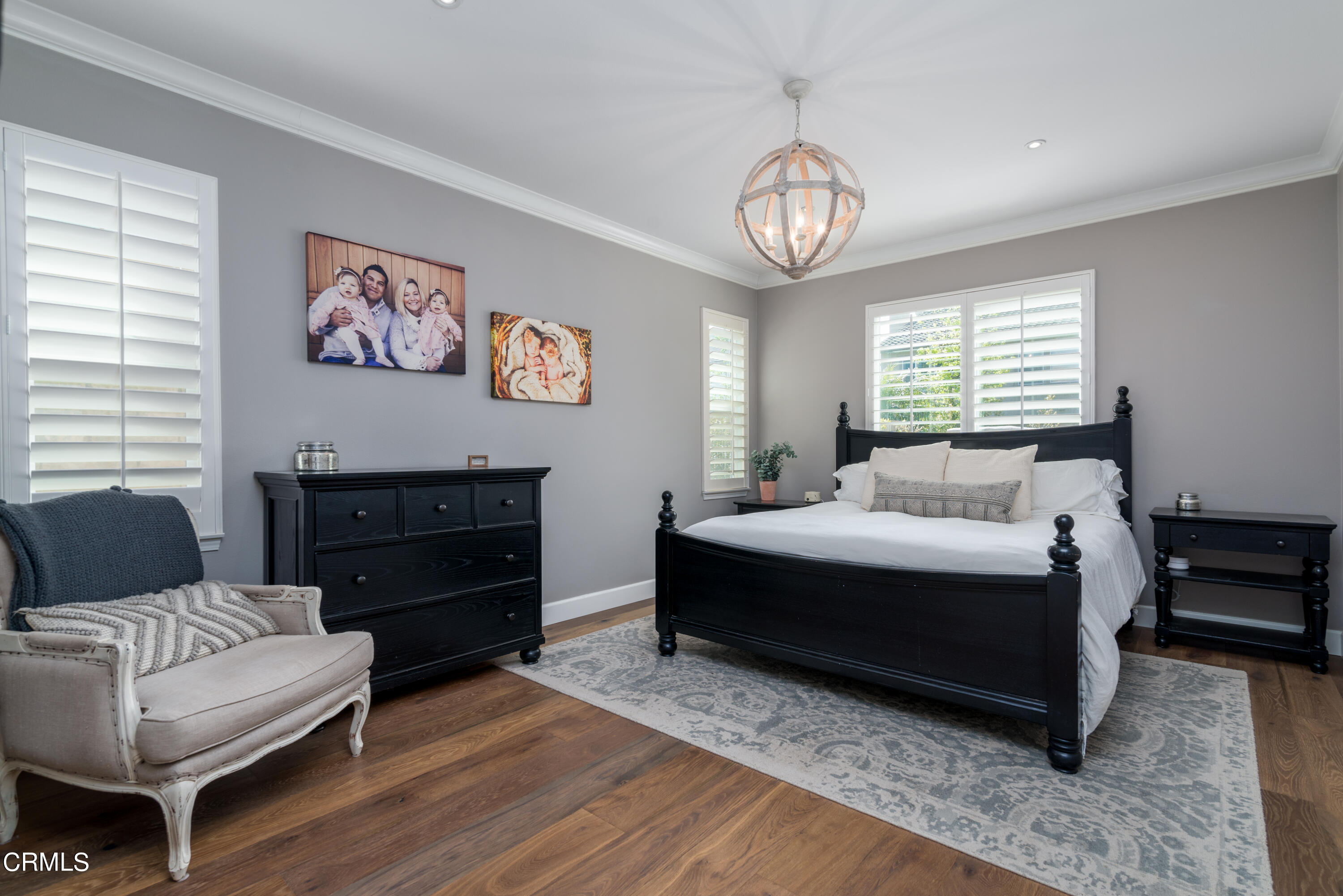 3064 White Rock Road Camarillo, CA 93012 - Photo 14 of 47 a bedroom with a bed and a chandelier