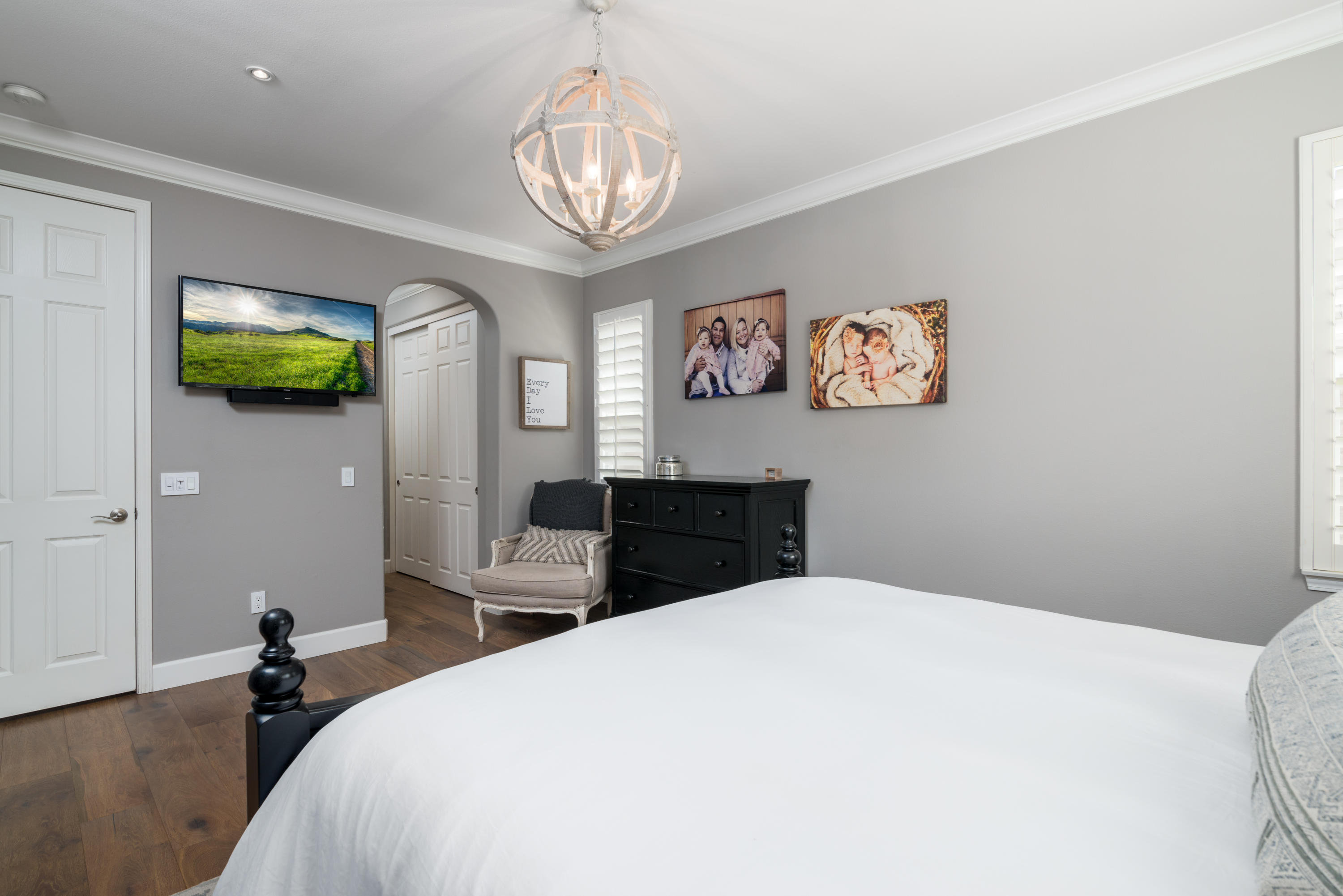 3064 White Rock Road Camarillo, CA 93012 - Photo 15 of 47 a bedroom with a bed and a chandelier