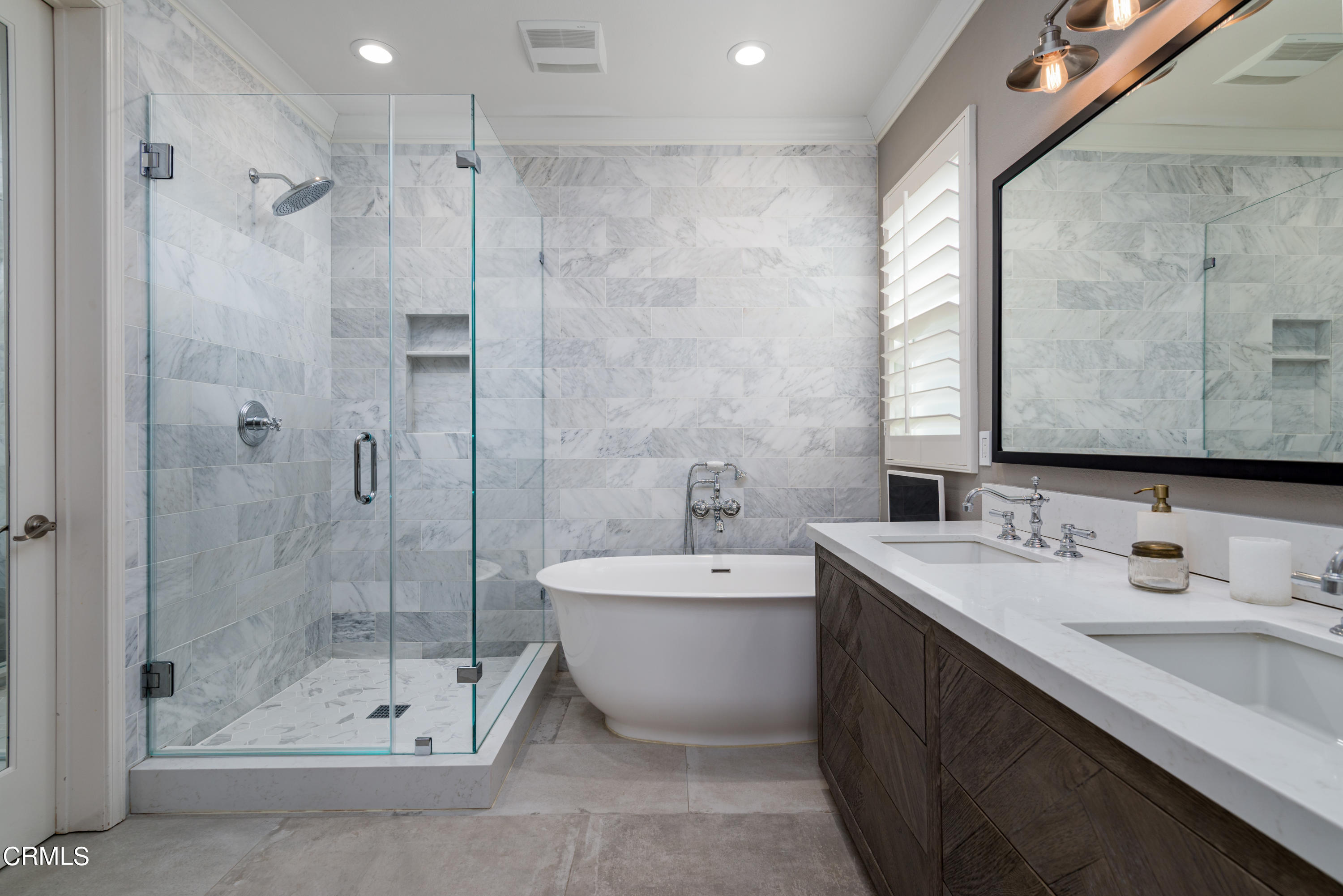 3064 White Rock Road Camarillo, CA 93012 - Photo 17 of 47 a bathroom with a double sink shower and mirror