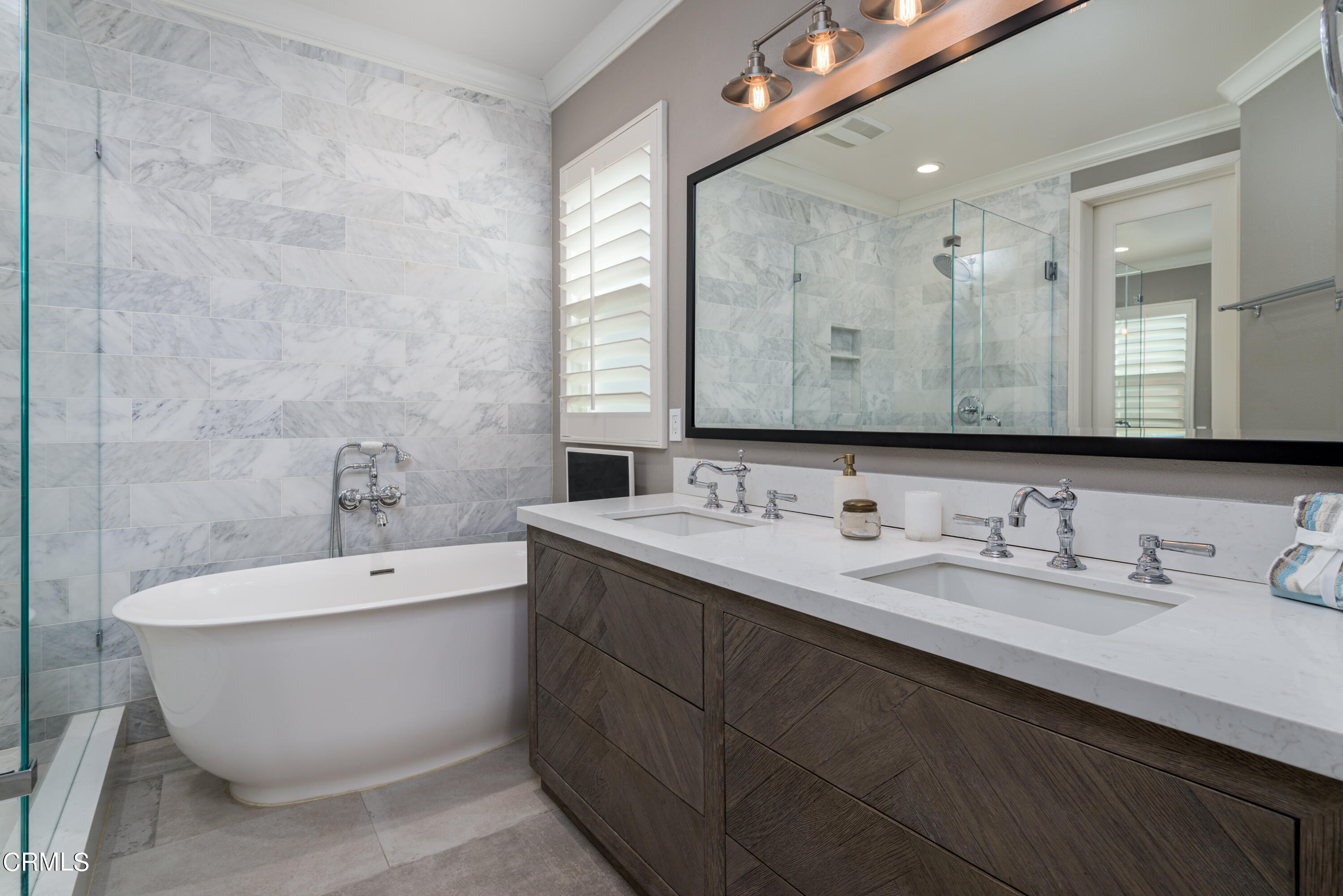 3064 White Rock Road Camarillo, CA 93012 - Photo 18 of 47 a bathroom with a white tub a sink and mirror